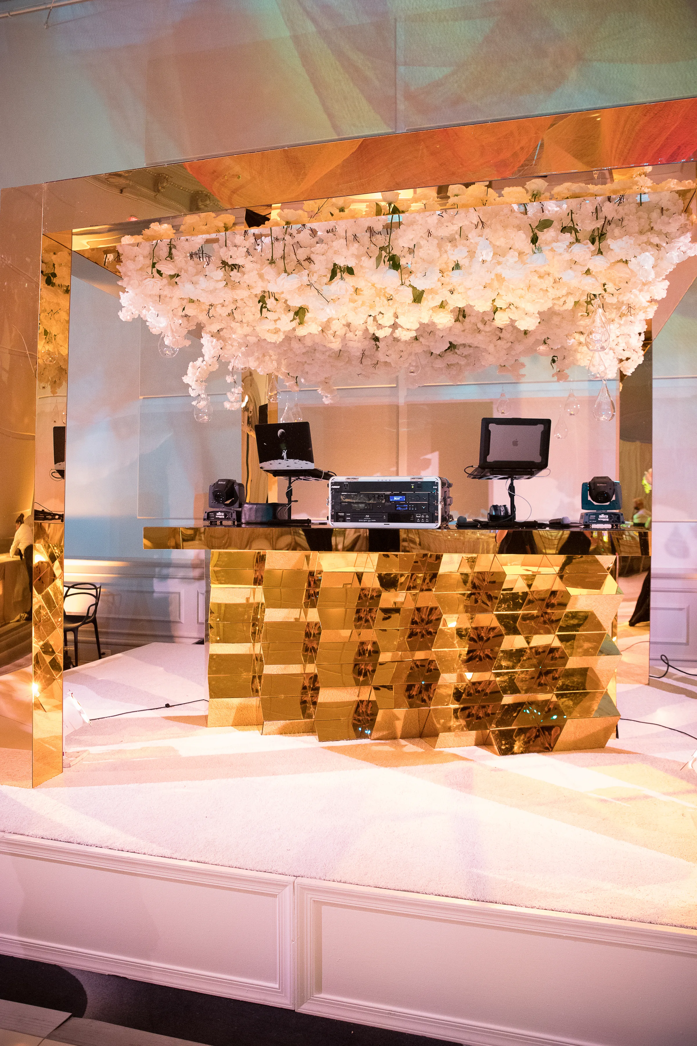 Gold croc-embossed built bar with suspended floral installation