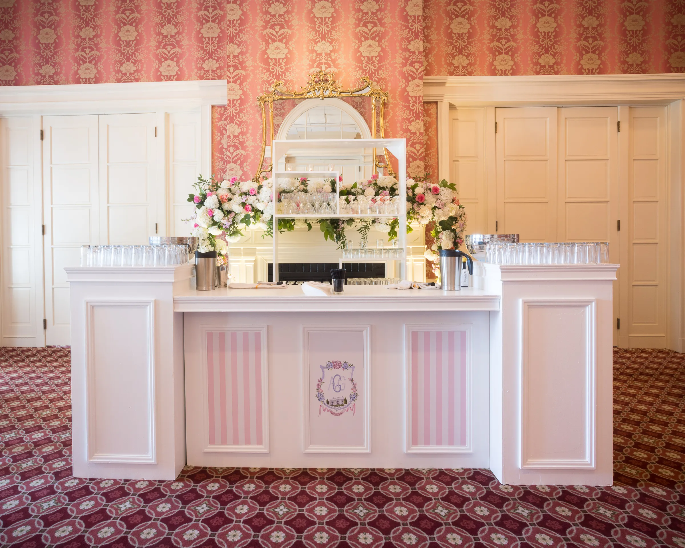 White wood bar with floral accents