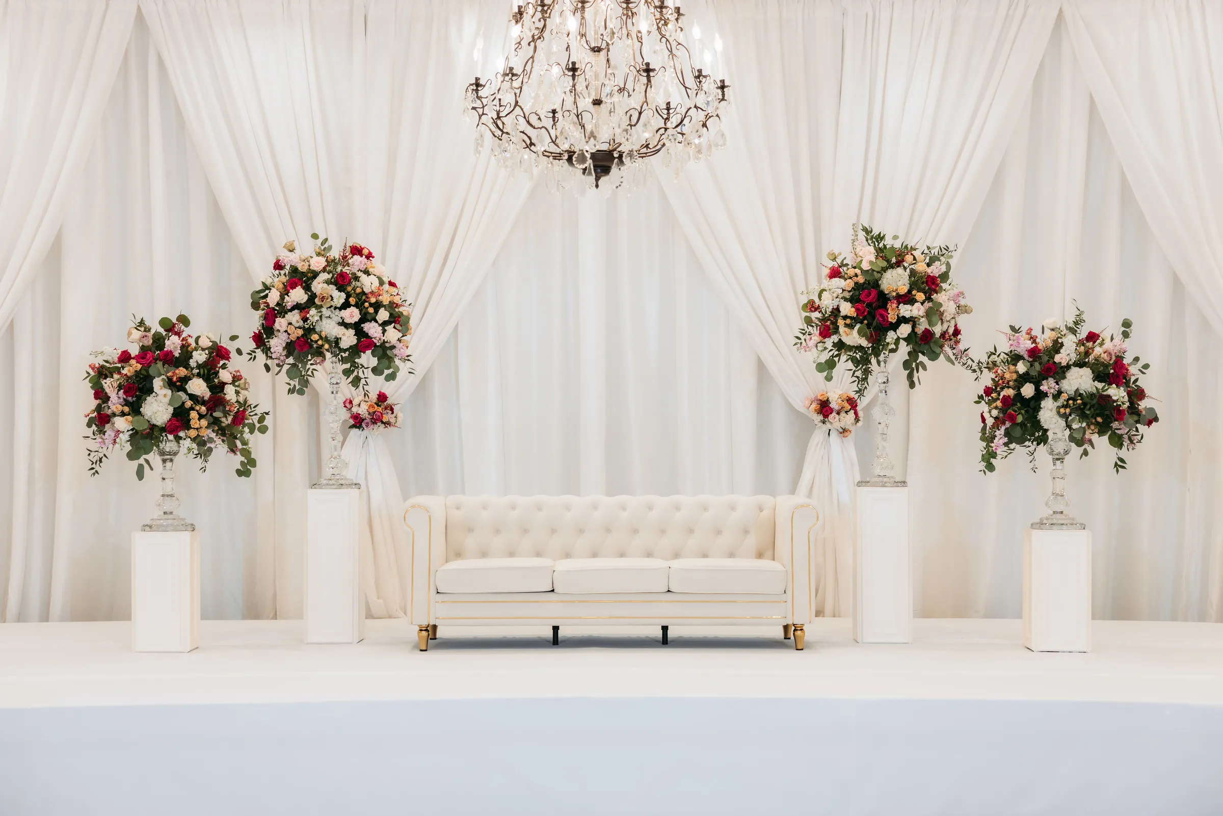 Tufted Couch Stage with Pipe and Drape